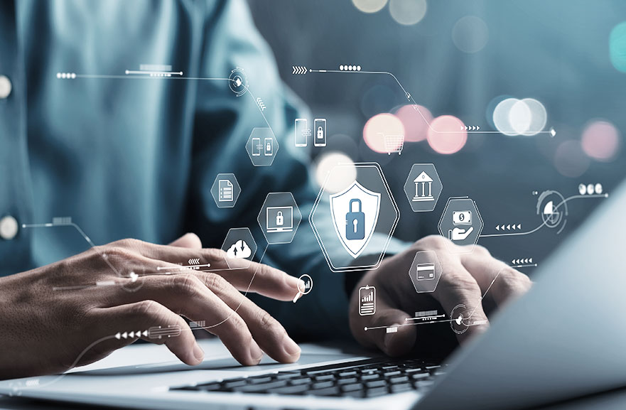 A person typing on a nottebok. Above, graphic representation of icons symbolizing technology and information security