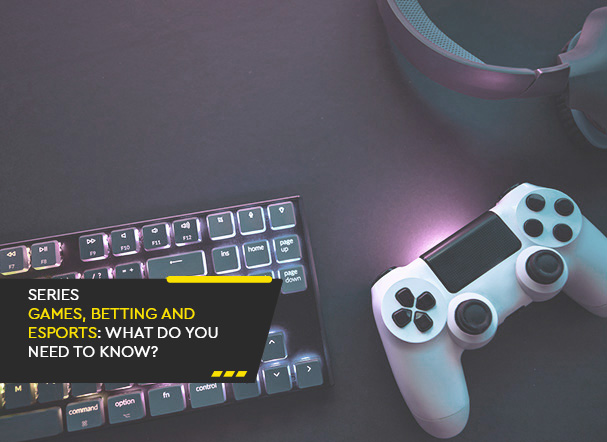 Top view of a black LED keyboard next to a white and black video game controller